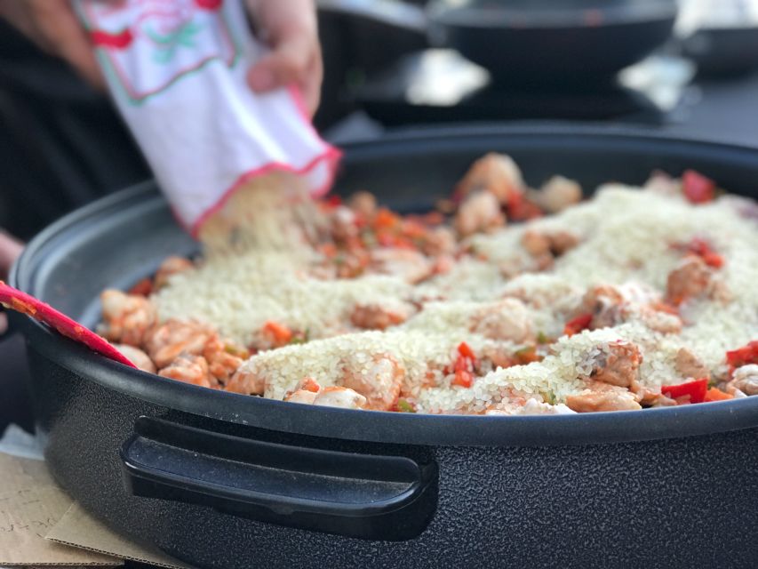 Seville: Paella Cooking Class & 30-Min Local Expert Q&A - Sitting down to the paella feast