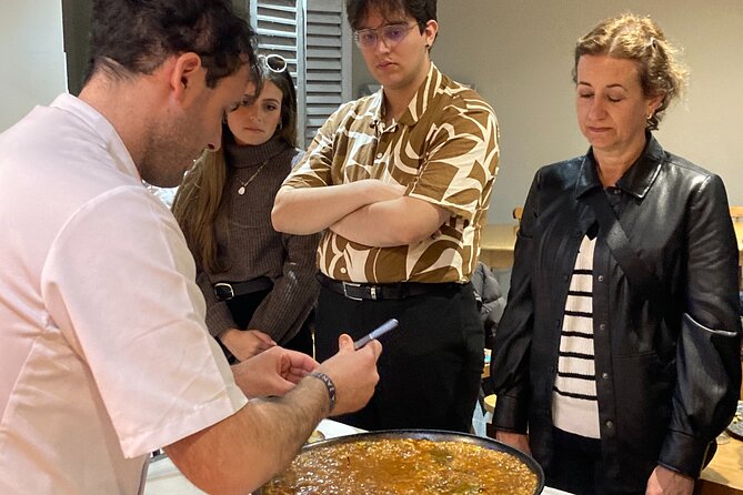 Seville: Paella Showcooking Experience - Watching the paella come together