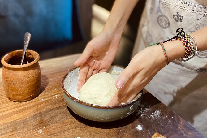 Small-Group Khinkali and Khachapuri Cooking Class in Tbilisi - Folding khinkali with the chef