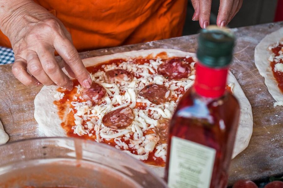 Sorrento: Pizza Making Class at Tirabusciò Cooking School - Choosing toppings and cooking your own pizza