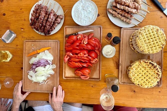 Souvlaki Cooking Class with Locals – Transfer Included - Eating what you cooked, with Greek white wine