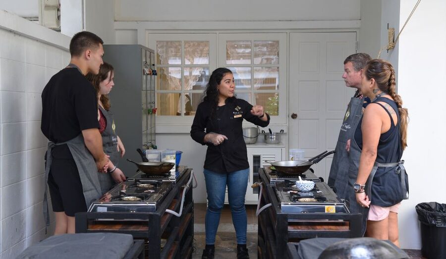 Sukhumvit: Hands-on Thai Cooking Class & Market Tour in BKK - A clean kitchen and well-planned preparation