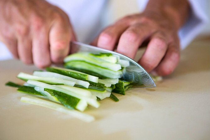 Sushi Making Cooking Class at a Local Brewery in Charlotte - Practicing knife skills with fresh ingredients